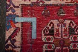 Backside of handmade 2000s Shiraz rug showing knot structure and weave density