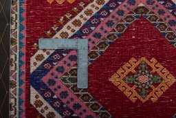 Backside of handmade 2000s Shiraz rug showing knot structure and weave density
