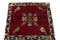 Surface texture of 2000s Shiraz rug with natural Wool and intricate pattern