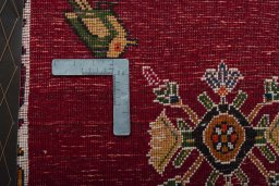 Backside of handmade 2000s Shiraz rug showing knot structure and weave density