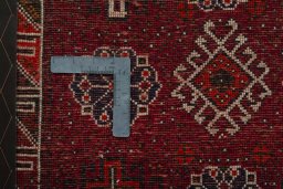 Backside of handmade 2000s Shiraz rug showing knot structure and weave density