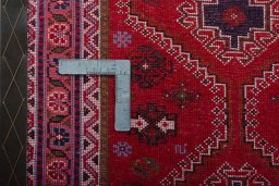 Backside of handmade 2000s Shiraz rug showing knot structure and weave density