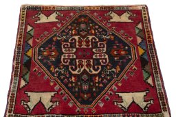 Surface texture of 2000s Shiraz rug with natural Wool and intricate pattern