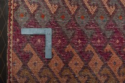 Backside of handmade 2000s Shiraz rug showing knot structure and weave density