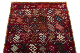 Surface texture of 2000s Shiraz rug with natural Wool and intricate pattern