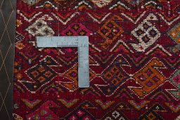 Backside of handmade 2000s Shiraz rug showing knot structure and weave density