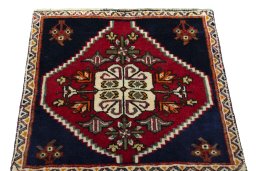 Surface texture of 2000s Shiraz rug with natural Wool and intricate pattern