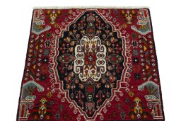 Surface texture of 2000s Shiraz rug with natural Wool and intricate pattern