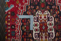 Backside of handmade 2000s Shiraz rug showing knot structure and weave density