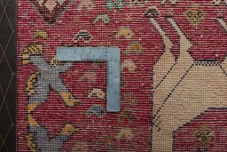 Backside of handmade 2000s Shiraz rug showing knot structure and weave density