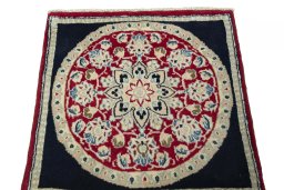Surface texture of 2000s Shiraz rug with natural Wool and intricate pattern