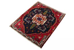 Corner detail of 2000s Shiraz rug showing border pattern and Wool pile