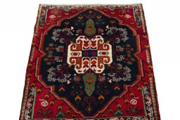 Surface texture of 2000s Shiraz rug with natural Wool and intricate pattern