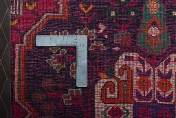 Backside of handmade 2000s Shiraz rug showing knot structure and weave density