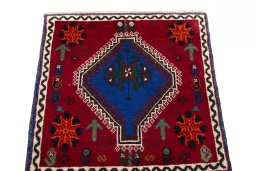 Surface texture of 2000s Shiraz rug with natural Wool and intricate pattern