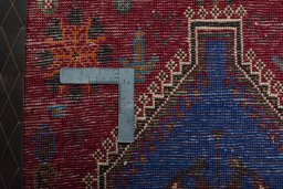 Backside of handmade 2000s Shiraz rug showing knot structure and weave density
