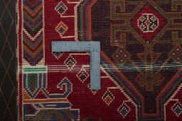 Backside of handmade 2000s Shiraz rug showing knot structure and weave density