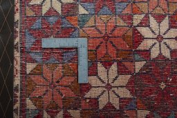 Backside of handmade 2000s Shiraz rug showing knot structure and weave density