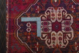 Backside of handmade 2000s Shiraz rug showing knot structure and weave density
