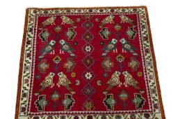 Surface texture of 2000s Shiraz rug with natural Wool and intricate pattern
