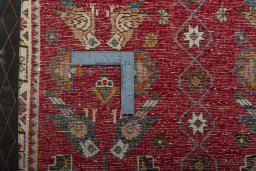 Backside of handmade 2000s Shiraz rug showing knot structure and weave density