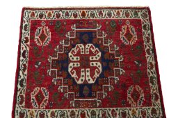 Surface texture of 2000s Shiraz rug with natural Wool and intricate pattern