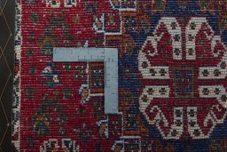 Backside of handmade 2000s Shiraz rug showing knot structure and weave density