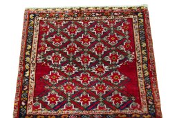 Surface texture of 2000s Shiraz rug with natural Wool and intricate pattern