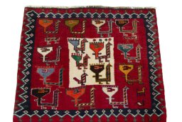 Surface texture of 2000s Shiraz rug with natural Wool and intricate pattern