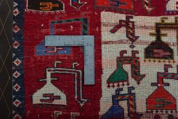 Backside of handmade 2000s Shiraz rug showing knot structure and weave density