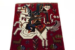 Surface texture of 2000s Shiraz rug with natural Wool and intricate pattern