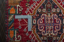 Backside of handmade 2000s Shiraz rug showing knot structure and weave density
