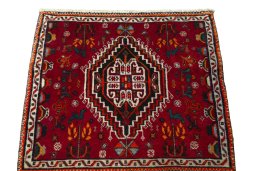 Surface texture of 2000s Shiraz rug with natural Wool and intricate pattern