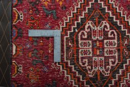 Backside of handmade 2000s Shiraz rug showing knot structure and weave density