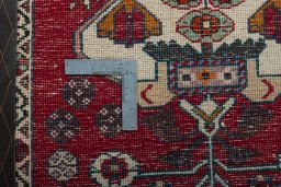 Backside of handmade 2000s Shiraz rug showing knot structure and weave density