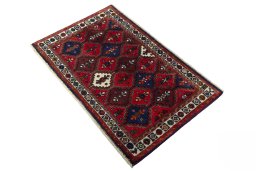 Corner detail of 2000s Shiraz rug showing border pattern and Wool pile