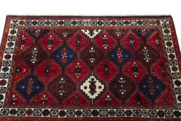 Surface texture of 2000s Shiraz rug with natural Wool and intricate pattern