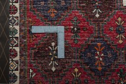 Backside of handmade 2000s Shiraz rug showing knot structure and weave density