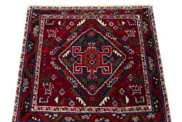 Surface texture of 2000s Shiraz rug with natural Wool and intricate pattern