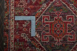 Backside of handmade 2000s Shiraz rug showing knot structure and weave density