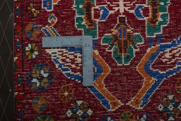 Backside of handmade 2000s Shiraz rug showing knot structure and weave density