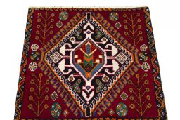 Surface texture of 2000s Shiraz rug with natural Wool and intricate pattern