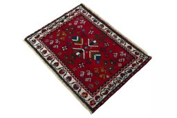 Corner detail of 2000s Shiraz rug showing border pattern and Wool pile
