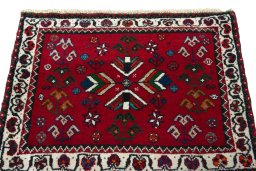 Surface texture of 2000s Shiraz rug with natural Wool and intricate pattern