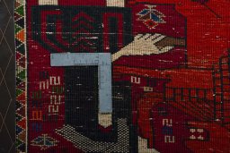 Backside of handmade 2000s Shiraz rug showing knot structure and weave density