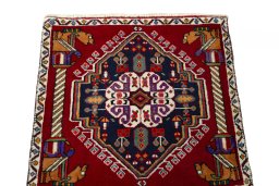 Surface texture of 2000s Shiraz rug with natural Wool and intricate pattern