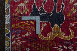 Backside of handmade 2000s Shiraz rug showing knot structure and weave density