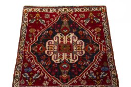 Surface texture of 2000s Shiraz rug with natural Wool and intricate pattern