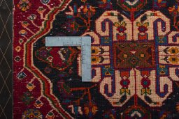 Backside of handmade 2000s Shiraz rug showing knot structure and weave density