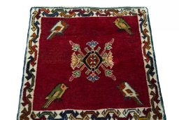 Surface texture of 2000s Shiraz rug with natural Wool and intricate pattern